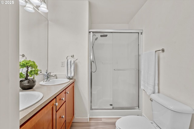 2590 NW 2nd Ter, Gresham, OR 97030 - bathroom featuring a shower stall, double vanity, and wood finished floors