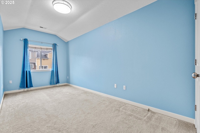 2590 NW 2nd Ter, Gresham, OR 97030 - carpeted empty room featuring vaulted ceiling and a textured ceiling