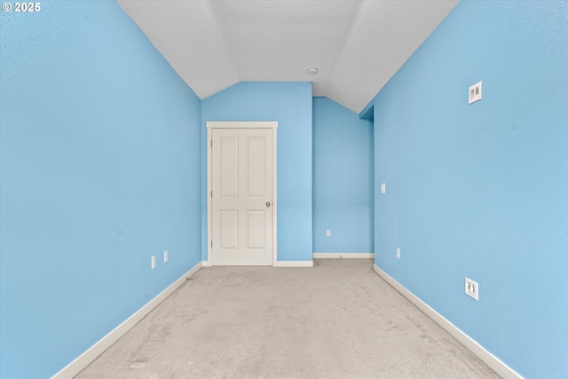 2590 NW 2nd Ter, Gresham, OR 97030 - unfurnished bedroom featuring vaulted ceiling and carpet
