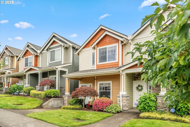 2590 NW 2nd Ter, Gresham, OR 97030 - view of front facade featuring covered porch, stone siding, and a front yard