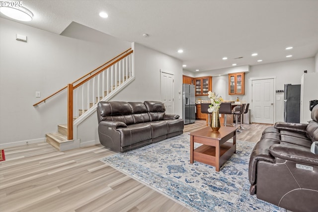 2590 NW 2nd Ter, Gresham, OR 97030 - living area featuring light wood-style flooring, stairway, and recessed lighting