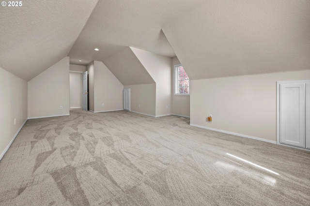 305 SW 169th Pl, Beaverton, OR 97006 - bonus room featuring carpet, vaulted ceiling, a textured ceiling, baseboards, and recessed lighting