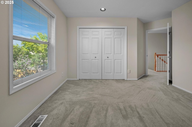 305 SW 169th Pl, Beaverton, OR 97006 - unfurnished bedroom featuring carpet, baseboards, a closet, and recessed lighting