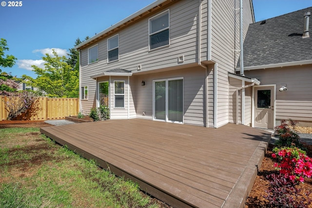 305 SW 169th Pl, Beaverton, OR 97006 - back of house featuring a wooden deck, fence, and roof with shingles