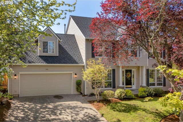 305 SW 169th Pl, Beaverton, OR 97006 - view of front of property featuring driveway, a garage, a front lawn, and a shingled roof