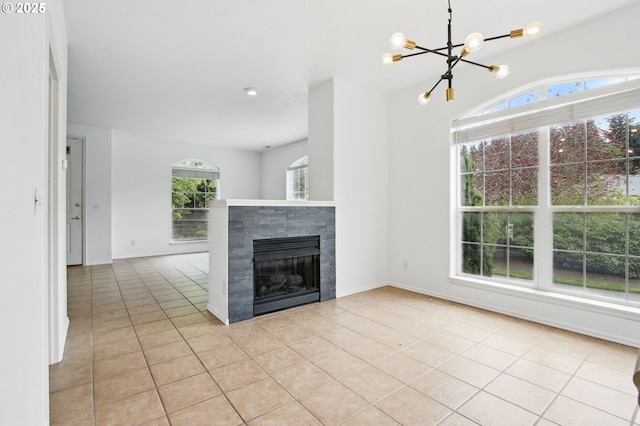 11660 SW Longspur Ter, Beaverton, OR 97007 - unfurnished living room with healthy amount of natural light, a chandelier, and light tile patterned flooring