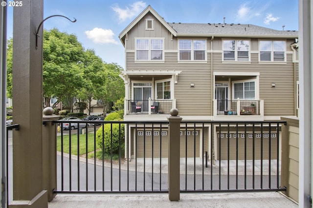11660 SW Longspur Ter, Beaverton, OR 97007 - rear view of house with a balcony and board and batten siding