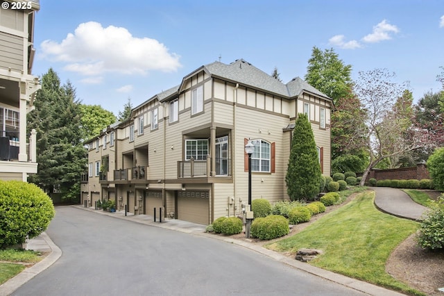 11660 SW Longspur Ter, Beaverton, OR 97007 - view of building exterior featuring a garage and asphalt driveway