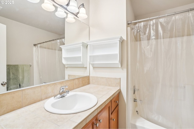 bathroom with shower / bath combination with curtain and vanity