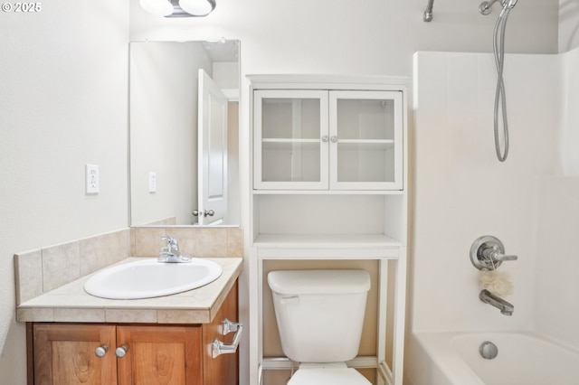 full bathroom featuring shower / tub combination, vanity, and toilet