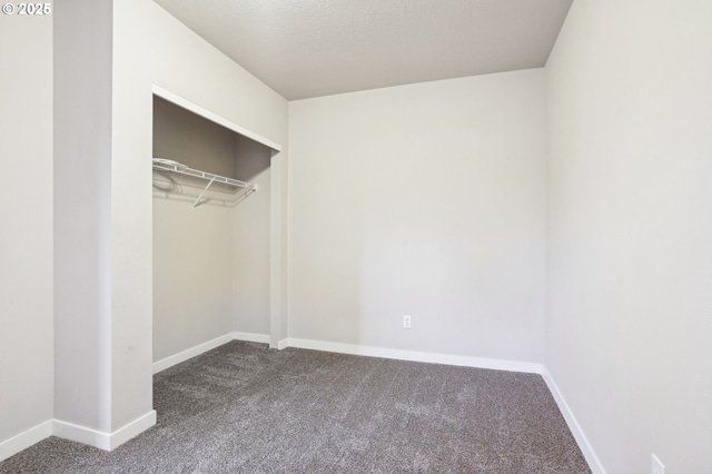 unfurnished bedroom with a closet and carpet