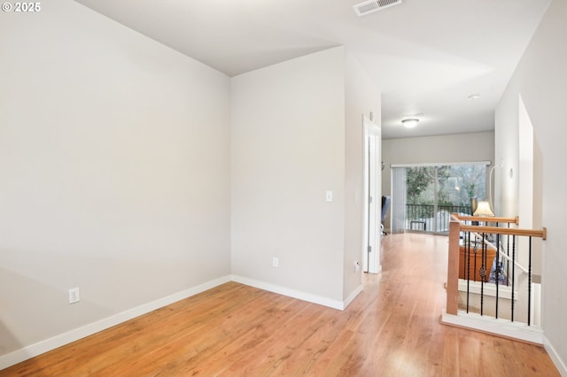 spare room featuring light hardwood / wood-style flooring