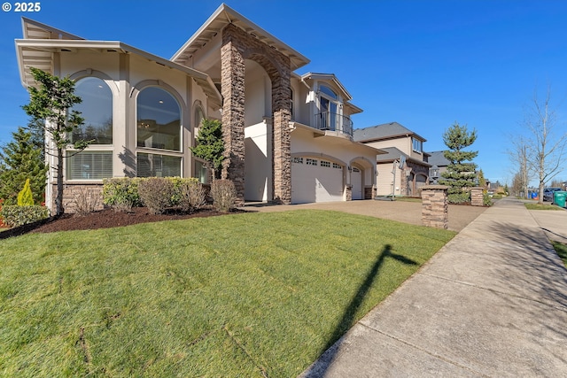 view of front of house with stucco siding, concrete driveway, an attached garage, a front yard, and a balcony