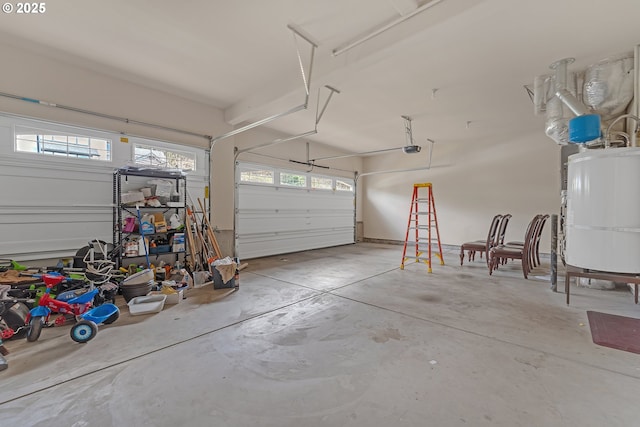 garage with gas water heater and a garage door opener