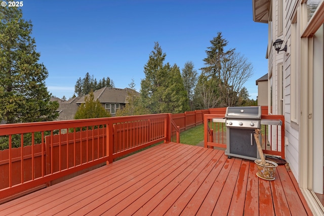 deck featuring fence and area for grilling