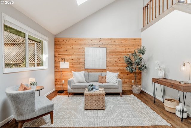 1505 NW 118th Ct, Portland, OR 97229 - living room with high vaulted ceiling, wood walls, and wood finished floors