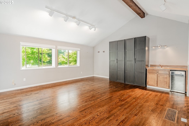 1505 NW 118th Ct, Portland, OR 97229 - unfurnished bedroom with track lighting, wine cooler, wood finished floors, and multiple windows