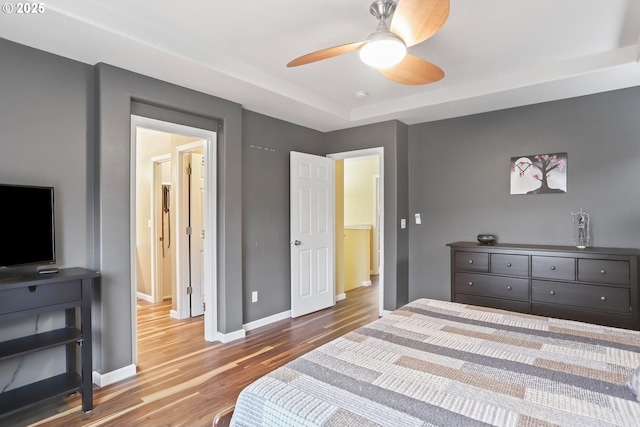 bedroom featuring ceiling fan and light hardwood / wood-style floors