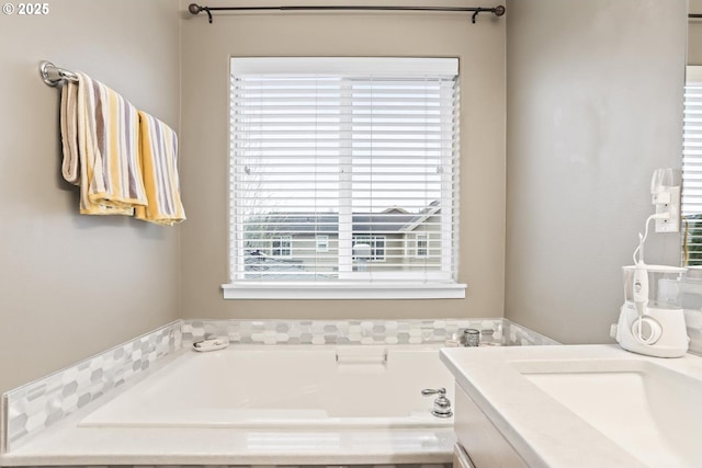 bathroom featuring vanity and a bathing tub