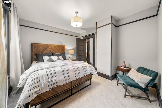 bedroom featuring light colored carpet