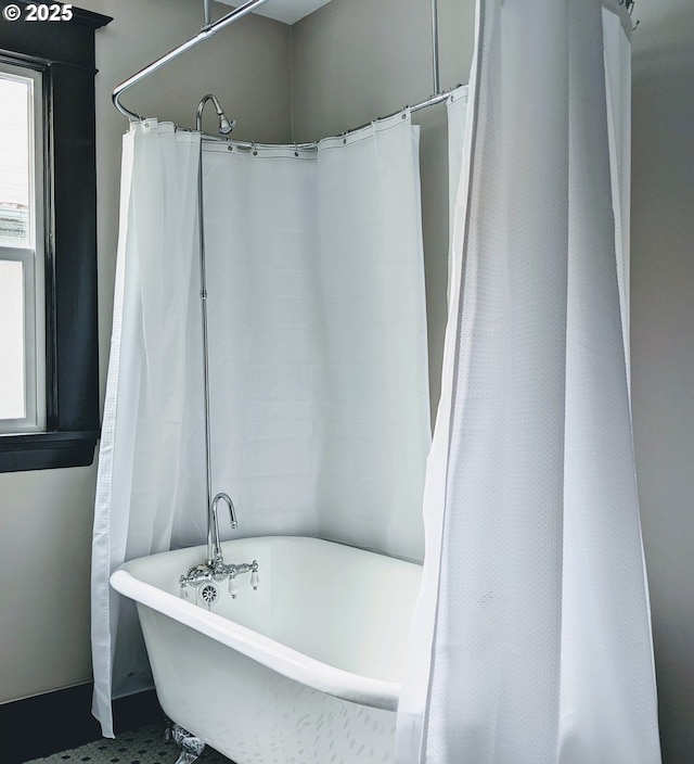 bathroom featuring a tub to relax in