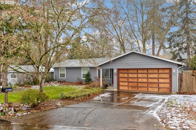 ranch-style home featuring a garage