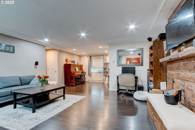 living room featuring dark hardwood / wood-style floors and baseboard heating