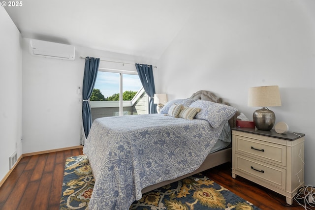 bedroom featuring a wall mounted air conditioner, access to outside, dark wood finished floors, vaulted ceiling, and baseboards