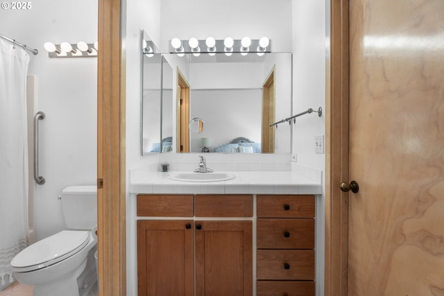 bathroom with vanity, toilet, a shower with curtain, and connected bathroom