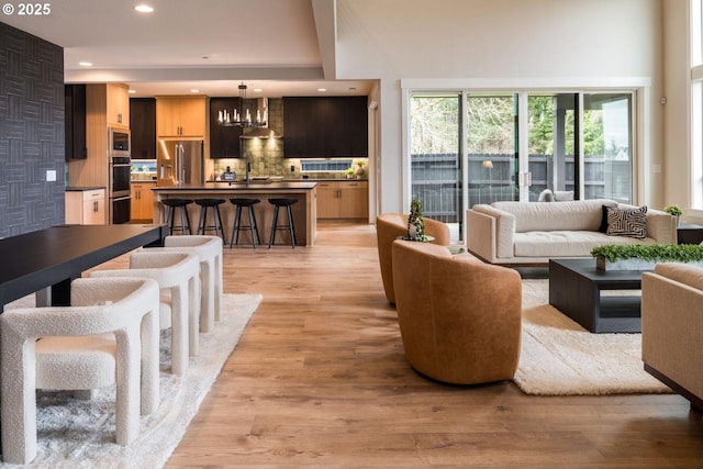 1006 S 48th Pl, Ridgefield, WA 98642 - living area featuring a chandelier, recessed lighting, and light wood-style flooring