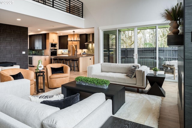 1006 S 48th Pl, Ridgefield, WA 98642 - living area featuring recessed lighting, light wood finished floors, and a high ceiling