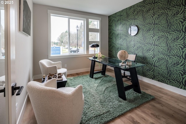 1006 S 48th Pl, Ridgefield, WA 98642 - office featuring an accent wall, wallpapered walls, baseboards, and wood finished floors