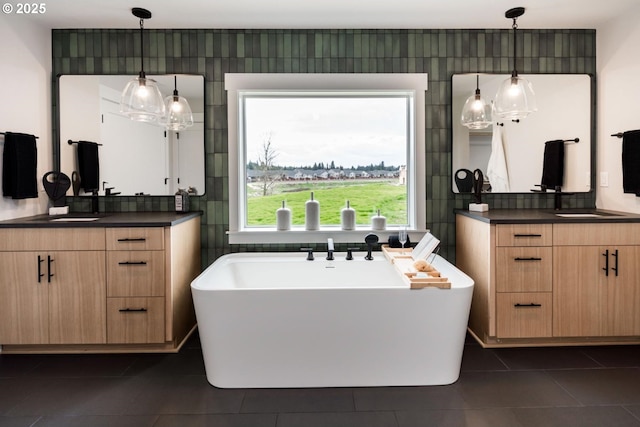 1006 S 48th Pl, Ridgefield, WA 98642 - full bath with tile patterned floors, a soaking tub, and two vanities