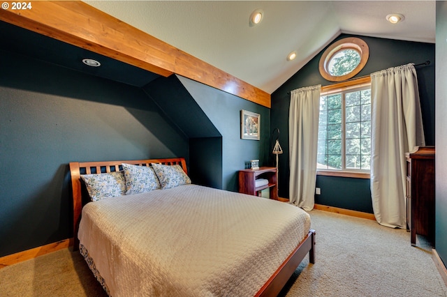 carpeted bedroom with vaulted ceiling