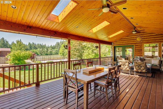 deck featuring a lawn and ceiling fan