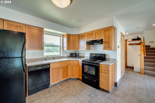 kitchen featuring sink and black appliances