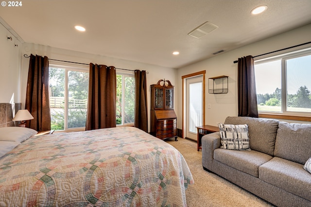 bedroom featuring light carpet