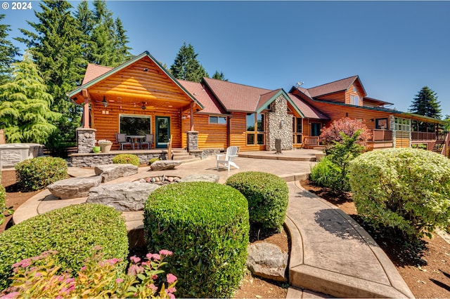 cabin with a patio area