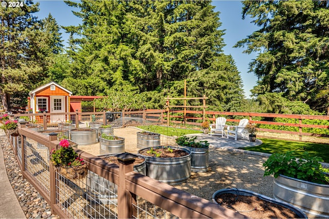 view of patio featuring an outbuilding