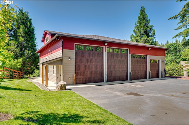 garage with a yard