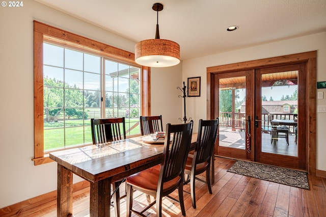 dining room featuring french doors and wood-type flooring