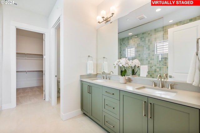 2784 N 49th Ave, Camas, WA 98607 - bathroom with tiled shower, double vanity, a sink, and tile patterned flooring