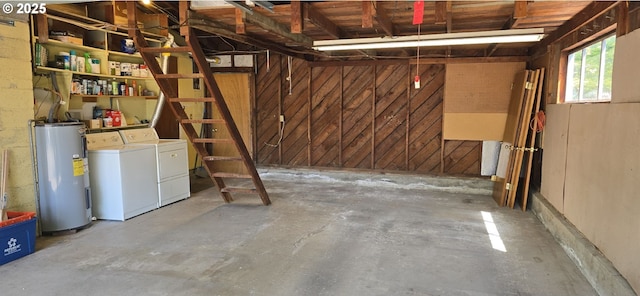 12950 SW 63rd Ave, Portland, OR 97219 - basement with electric water heater, separate washer and dryer, and wood walls