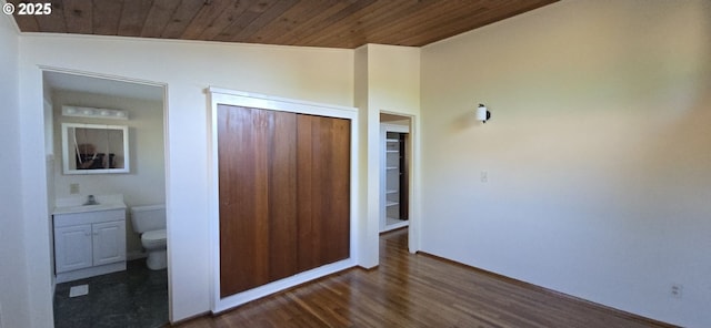 12950 SW 63rd Ave, Portland, OR 97219 - unfurnished bedroom with wooden ceiling, wood finished floors, a closet, baseboards, and a sink