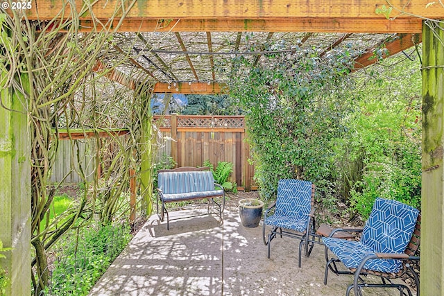 view of patio / terrace featuring fence and a pergola
