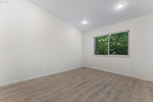 1397 Bonniebrae Dr, Lake Oswego, OR 97034 - unfurnished room featuring vaulted ceiling, baseboards, and light wood finished floors