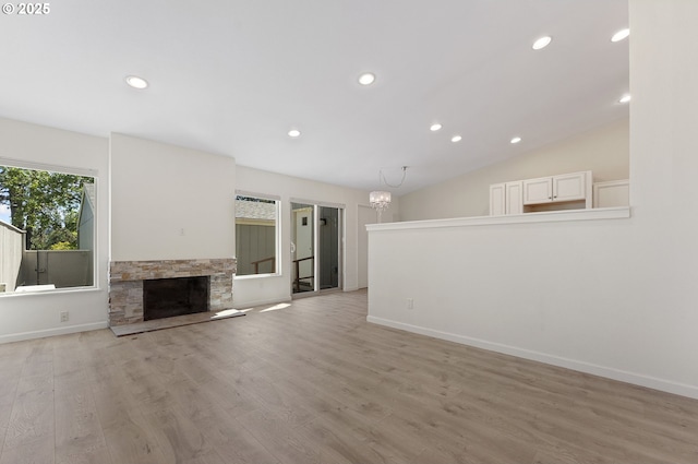1397 Bonniebrae Dr, Lake Oswego, OR 97034 - unfurnished living room featuring recessed lighting, light wood-type flooring, a chandelier, a fireplace, and baseboards