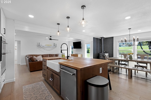 1069 Little Valley Rd, Roseburg, OR 97471 - kitchen with dishwasher, open floor plan, wooden counters, light wood finished floors, and a ceiling fan