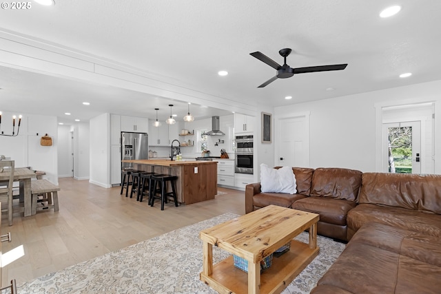 1069 Little Valley Rd, Roseburg, OR 97471 - living room with light wood-style flooring, ceiling fan, recessed lighting, and a chandelier