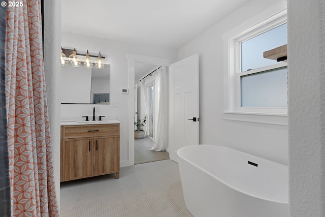 1069 Little Valley Rd, Roseburg, OR 97471 - bathroom with vanity, a freestanding tub, and tile patterned floors